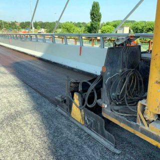 Resurfacing a road surface via slurry seal microsurfacing - Slurry Srl