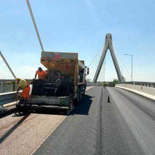 Ferrara - laying slurry seal, slurry microsurfacing for road safety